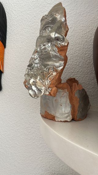 escultura cabeza barro