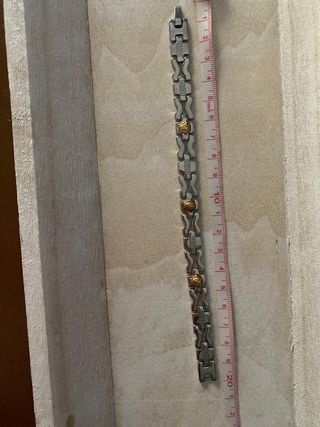 Pulsera acero inox con cabezas de león doradas