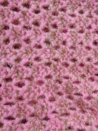 Cárdigan rosa de punto con botones perla