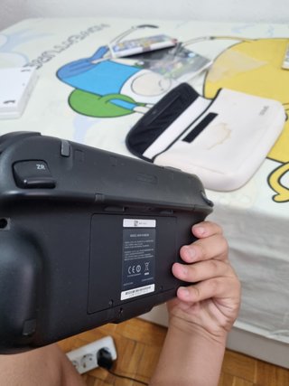 Wii U gamepad y dos juegos