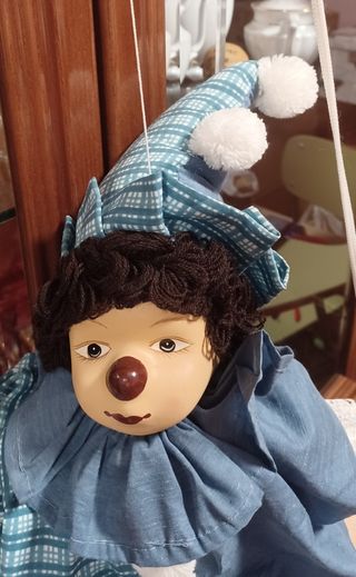 Marioneta clown columpio