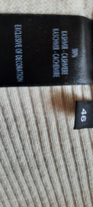 Golf cachemire bianco panna. apertura nascosta sul