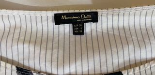 Camisa con flores blancas y negras