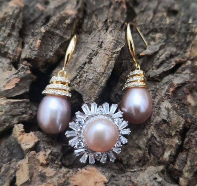 Anillo a 10 la unidad de plata con perla rosada.