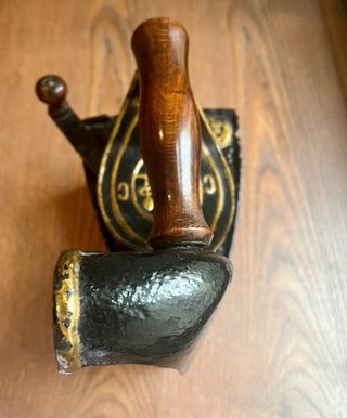 Antigua plancha de carbón