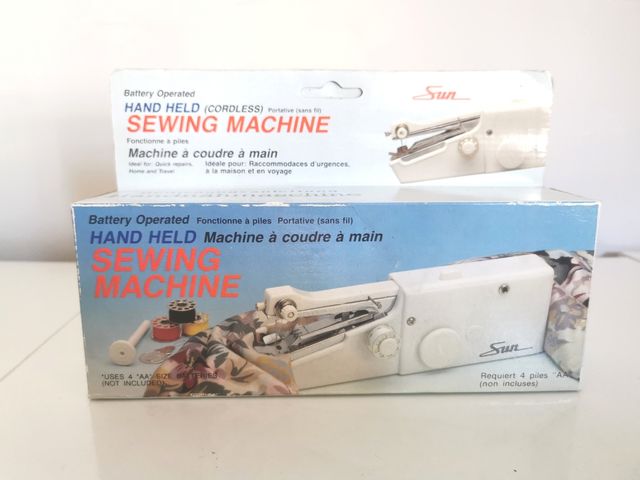 Maquina de coser de mano. Sun