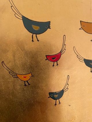 Jarrón y plato de decoración dorados