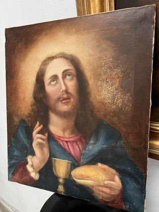 Jesús bendiciendo el pan y el vino.