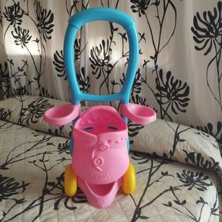 Muñeca con carrito y biberón