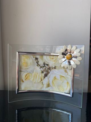 Cornice curva in vetro con dettagli argento