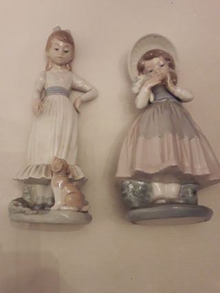 Dos figuras de nao de lladro.Niña con flores y ..