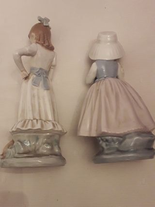 Dos figuras de nao de lladro.Niña con flores y ..