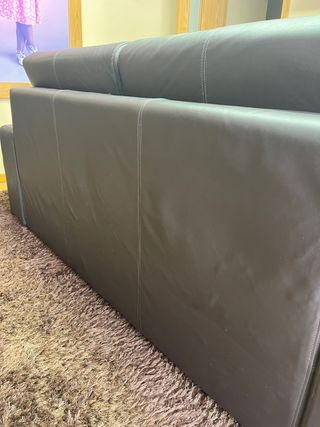 Sofá-cama tapizado en piel