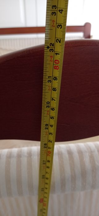 Minicuna de madera con su colchón y ropa a juego