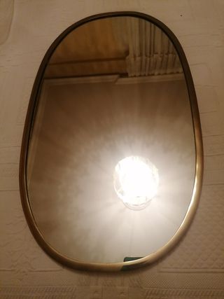 Espejo dorado ovalado