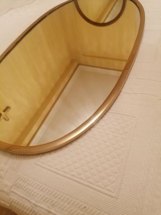 Espejo dorado ovalado