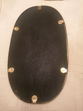 Espejo dorado ovalado