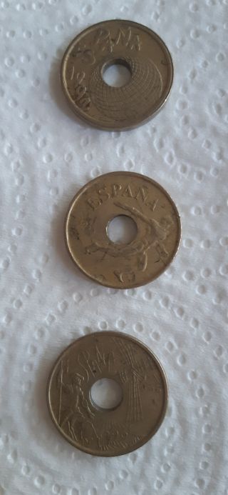 Monedas 25 pesetas con agujero