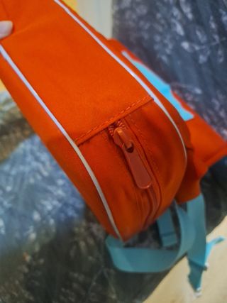 Alzador silla de viaje. Color naranja