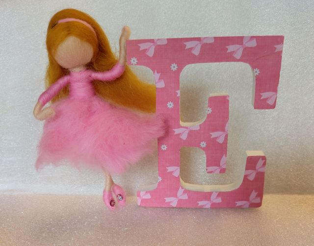 Bambole in lana cardata