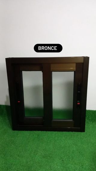 Ventana de aluminio plata y bronce