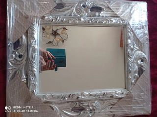 Specchio barocco intagliato in foglia argento