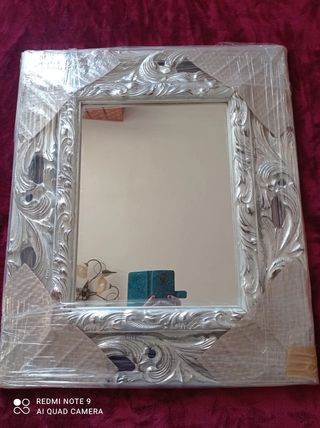 Specchio barocco intagliato in foglia argento