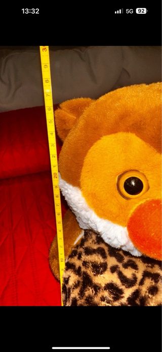 Peluche con tasca posteriore