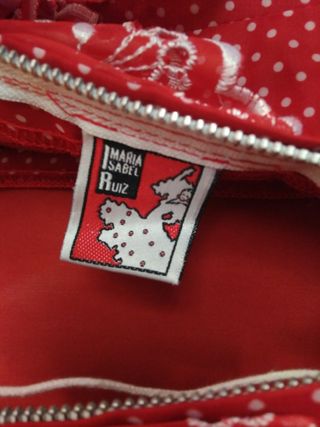 Traje de sevillana o flamenca de Maria I. Ruiz, Es