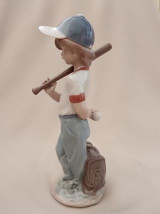 Porcelanas Lladró niño béisbol y niña flores