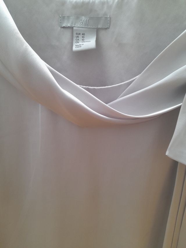 Vestido  H&M talla L blanco plateado