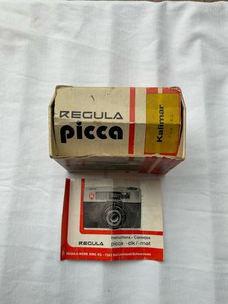 Scatola e istruzioni macchina fotografia Regula