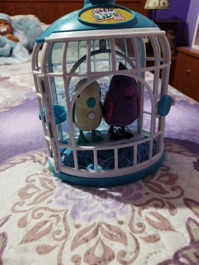 Juguete jaula con canarios