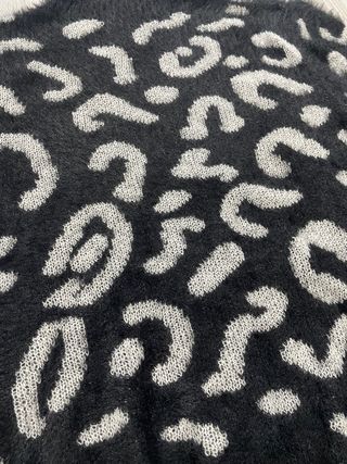 Jersey cuello alto negro y plateado