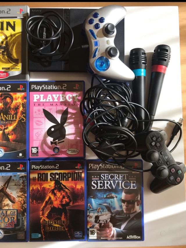 PLAY STATION CON 20 JUEGOS Y SINGSTAR