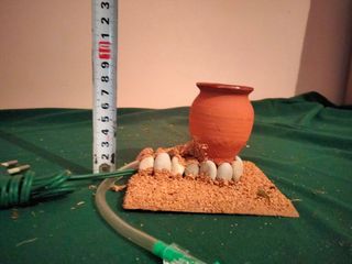 Olla caldero columnas romanas luz Belén