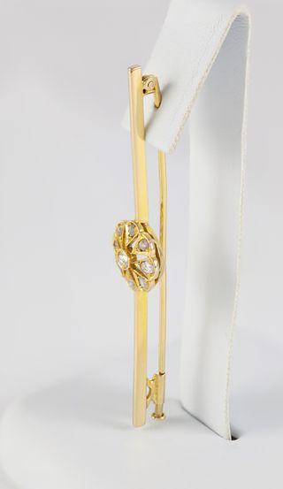 Broche antiguo en oro amarillo 18k y brillantes