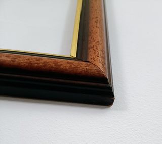 Marco de madera y dorado