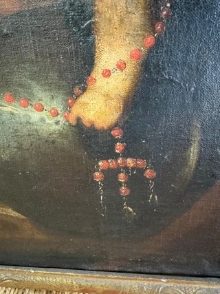 Virgen del Rosario con niño en brazos.