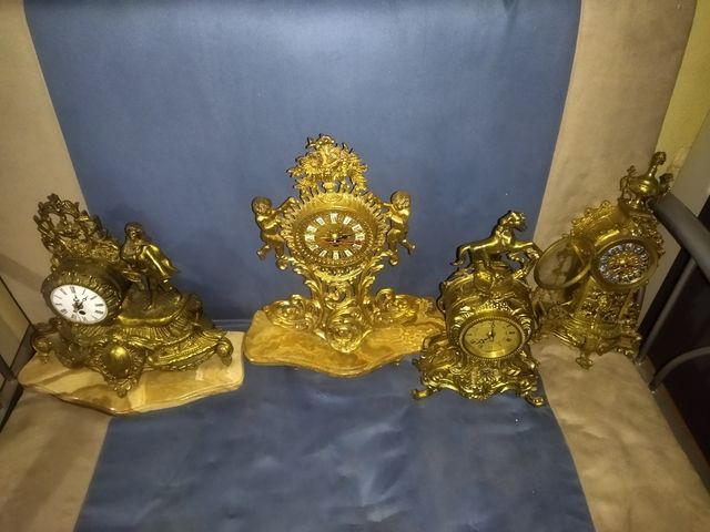 4 orologi antichi realizzati in.. bronzo.