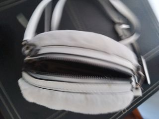 Bolso bombo era símil  piel y símil cuer