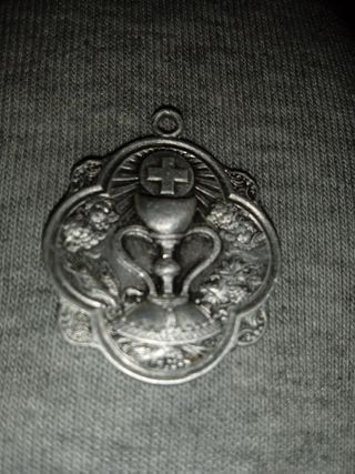 Medalla antigua de 100 años