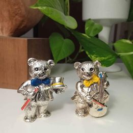 Coppia di orsetti musicisti placcati in argento