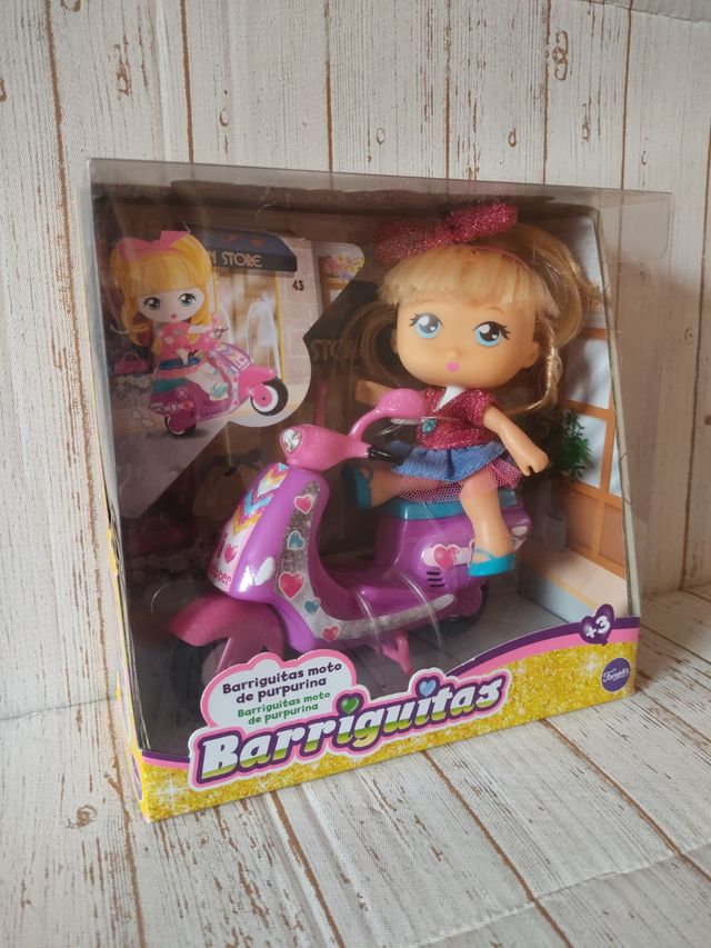 Muñeca Barriguita Moto de purpurina Famosa