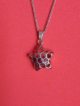 Colgante estrella calada en plata