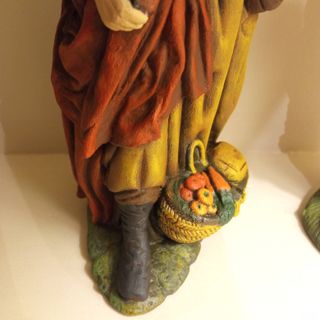 Pastor de Belén con ofrenda de frutas