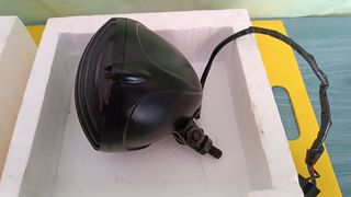 Conjunto de Faro del y tras do mcicleta