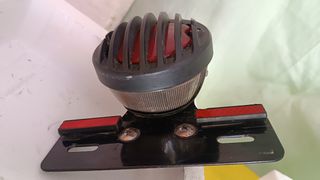 Conjunto de Faro del y tras do mcicleta