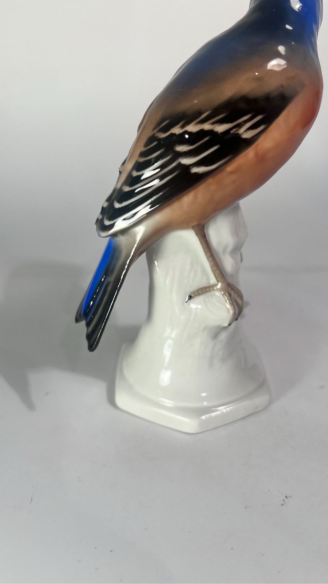 Statuetta in ceramica con uccellino blu arancione