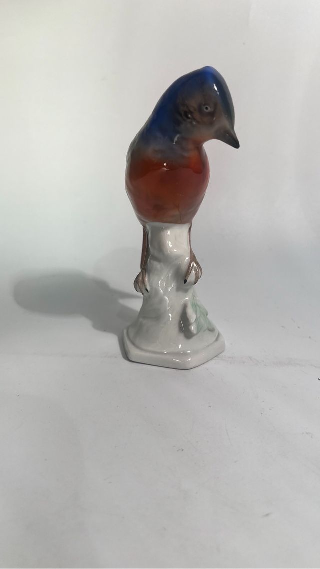 Statuetta in ceramica con uccellino blu arancione